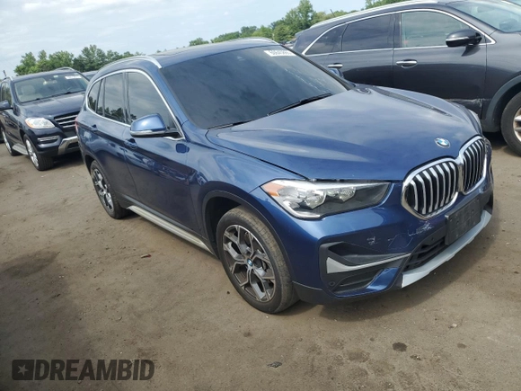 2021 BMW X1 xDrive28i with VIN WBXJG9C0XM5U47141, listed as a Copart auction lot 60645865 with 56,106 mi miles and Salvage title. Bid and sale history available at DreamBid. Image 4.