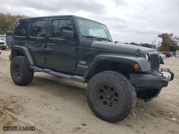 2011 Jeep Wrangler Unlimited Sahara with VIN 1J4BA5H16BL557068, listed as a Copart auction lot 80429454 with 142,428 mi miles and Salvage Title. Bid and sale history available at carsss.com. Image 4.