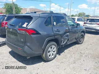 2019 Toyota RAV4 LE with VIN JTMG1RFV9KD014526, listed as a IAAI auction lot 42638858 with 90,995 mi miles and . Bid and sale history available at DreamBid. Image 4.