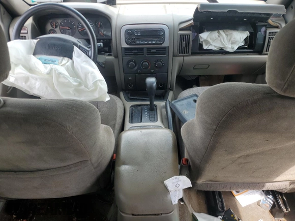 2000 Jeep Grand Cherokee Laredo с VIN 1J4G248S4YC299003, выставлен на аукционе Copart как лот 55937685 с пробегом Не указан миль и Списание • Salvage title. История ставок и продаж доступна на DreamBid. Изображение 8.