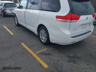2014 Toyota Sienna XLE with VIN 5TDYK3DCXES470852, listed as a IAAI auction lot 42053266 with 48,512 mi miles. Bid and sale history available at carsss.com. Image 3.