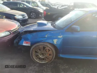 2005 Subaru Impreza Sedan (Natl) WRX STi w/Gold Wheels with VIN JF1GD70655L511554, listed as a IAAI auction lot 41391019 with 124,725 mi miles. Bid and sale history available at carsss.com. Image 9.