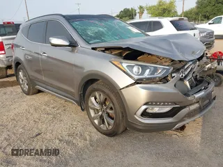 2018 Hyundai Santa Fe Ultimate z VIN 5NMZWDLAXJH100108, wystawiony jako IAAI lot #42126768 z przebiegiem 68 325 mil mil oraz . Historia ofert i sprzedaży dostępna na DreamBid. Obrazek 1.