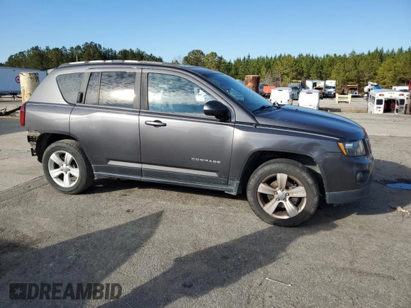 2015 Jeep Compass Latitude with VIN 1C4NJCEBXFD274712, listed as a Copart auction lot 41638375 with 142,684 mi miles and Salvage Title. Bid and sale history available at carsss.com. Image 4.