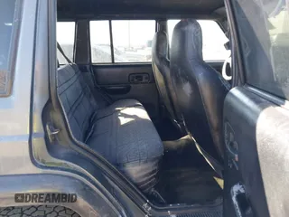 1997 Jeep Cherokee Sport with VIN 1J4FJ68S4VL567490, listed as a IAAI auction lot 41659872 with 404,766 mi miles. Bid and sale history available at carsss.com. Image 8.