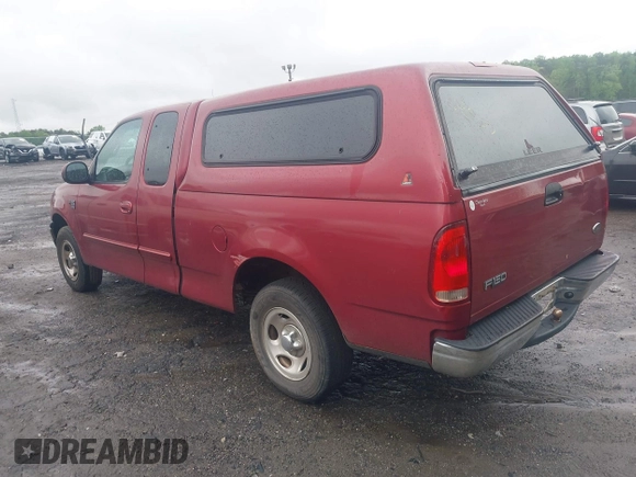 2000 Ford F-150 XL with VIN 1FTRX17W5YNB91724, listed as a IAAI auction lot 41954818 with 156,718 mi miles. Bid and sale history available at carsss.com. Image 3.