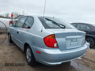 2003 Hyundai Accent GL with VIN KMHCG35C23U264360, listed as a IAAI auction lot 42033316 with 100,991 mi miles. Bid and sale history available at carsss.com. Image 3.