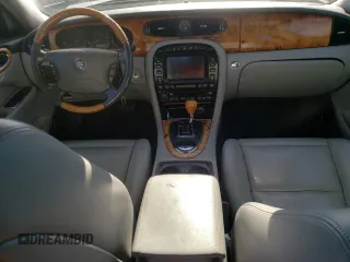 2004 Jaguar XJ with VIN SAJWA71C74SG34056, listed as a Copart auction lot 80083014 with 0 mi miles and Salvage Title. Bid and sale history available at carsss.com. Image 8.