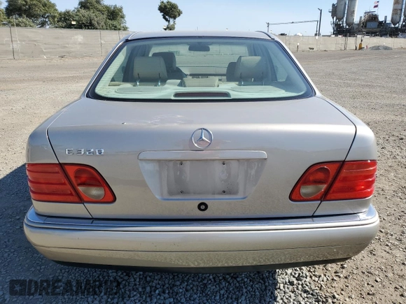 1999 Mercedes-Benz E-Class with VIN WDBJF65H5XA804902, listed as a Copart auction lot 73704634 with 92,411 mi miles and Salvage Title. Bid and sale history available at carsss.com. Image 6.