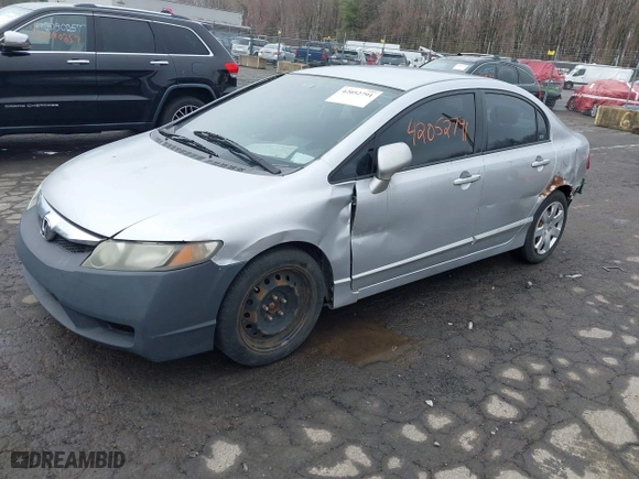 2009 Honda Civic Sdn LX with VIN 2HGFA16559H313538, listed as a IAAI auction lot 42052791 with 136,594 mi miles. Bid and sale history available at carsss.com. Image 2.