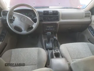 2002 Isuzu Rodeo S with VIN 4S2DM58W824313096, listed as a Copart auction lot 77951364 with 127,470 mi miles and Salvage Title. Bid and sale history available at DreamBid. Image 8.