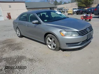 2013 Volkswagen Passat SE w/Sunroof & Nav with VIN 1VWBP7A37DC125598, listed as a IAAI auction lot 42022573 with 149,812 mi miles. Bid and sale history available at carsss.com. Image 1.