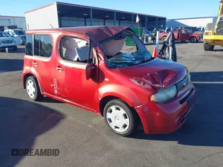 2011 Nissan Cube S z VIN JN8AZ2KRXBT214386, wystawiony jako IAAI lot #40831086 z przebiegiem 173 367 mil mil oraz . Historia ofert i sprzedaży dostępna na DreamBid. Obrazek 1.