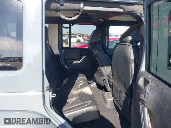 2015 Jeep Wrangler Unlimited Rubicon with VIN 1C4BJWFG7FL525724, listed as a IAAI auction lot 41394059 with 132,058 mi miles. Bid and sale history available at carsss.com. Image 8.