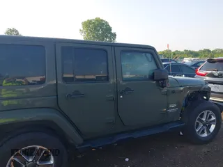 2015 Jeep Wrangler Unlimited Altitude с VIN 1C4HJWEG7FL584395, выставлен на аукционе IAAI как лот 42399987 с пробегом 142 906 миль миль и . История ставок и продаж доступна на DreamBid. Изображение 14.