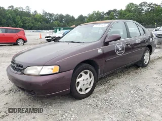 1999 Nissan Altima XE z VIN 1N4DL01D8XC144467, wystawiony jako Copart lot #57971335 z przebiegiem 230 667 mil mil oraz Szkoda całkowita • Salvage title. Historia ofert i sprzedaży dostępna na DreamBid. Obrazek 1.