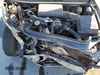 1999 Jeep Grand Cherokee Laredo with VIN 1J4GW58NXXC776438, listed as a Copart auction lot 84412044 with 163,060 mi miles and Salvage title. Bid and sale history available at DreamBid. Image 12.