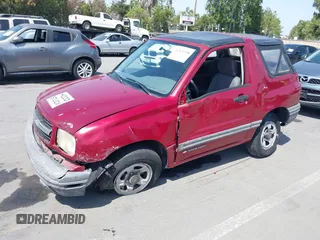 1999 Chevrolet Tracker z VIN 2CNBJ1865X6935435, wystawiony jako IAAI lot #42421108 z przebiegiem Nie podano mil oraz . Historia ofert i sprzedaży dostępna na DreamBid. Obrazek 6.