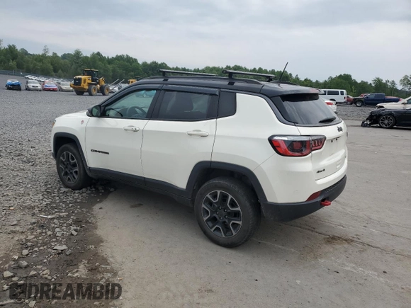 2019 Jeep Compass Trailhawk with VIN 3C4NJDDB5KT671613, listed as a Copart auction lot 61023125 with 64,793 mi miles and Salvage title. Bid and sale history available at DreamBid. Image 2.