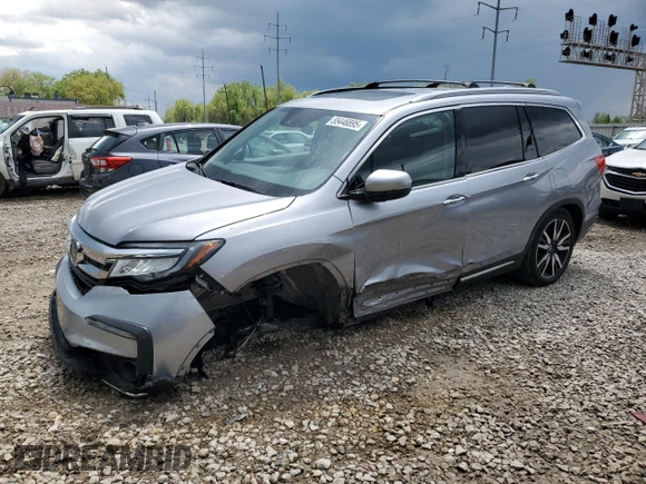2022 Honda Pilot Touring 7-Passenger with VIN 5FNYF6H69NB019572, listed as a Copart auction lot 55446895 with 82,424 mi miles and Salvage title. Bid and sale history available at DreamBid. Image 1.