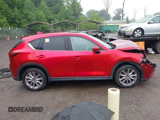 2019 Mazda CX-5 Grand Touring with VIN JM3KFBDM8K0693622, listed as a IAAI auction lot 42503818 with 60,812 mi miles and . Bid and sale history available at DreamBid. Image 12.