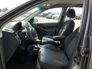 2006 Ford Focus S z VIN 1FAFP37N76W182882, wystawiony jako Copart lot #56939295 z przebiegiem 136 831 mil mil oraz Szkoda całkowita • Salvage title. Historia ofert i sprzedaży dostępna na DreamBid. Obrazek 7.