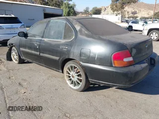 1998 Nissan Altima XE with VIN 1N4DL01D0WC237630, listed as a IAAI auction lot 41297277 with 101,965 mi miles. Bid and sale history available at carsss.com. Image 3.