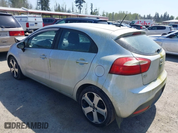2014 Kia Rio SX with VIN KNADN5A31E6353714, listed as a IAAI auction lot 42127657 with 117,544 mi miles. Bid and sale history available at carsss.com. Image 3.