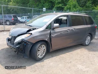 2015 Toyota Sienna XLE with VIN 5TDYK3DC6FS553695, listed as a IAAI auction lot 42418507 with 137,677 mi miles and . Bid and sale history available at DreamBid. Image 2.