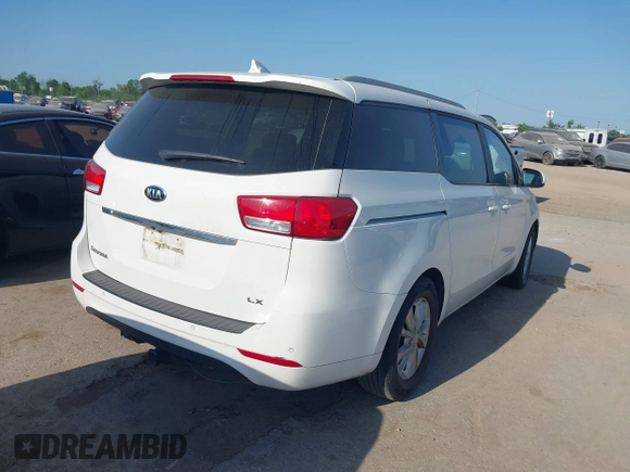 2015 Kia Sedona LX with VIN KNDMB5C10F6027850, listed as a IAAI auction lot 42010344 with 127,019 mi miles. Bid and sale history available at carsss.com. Image 4.