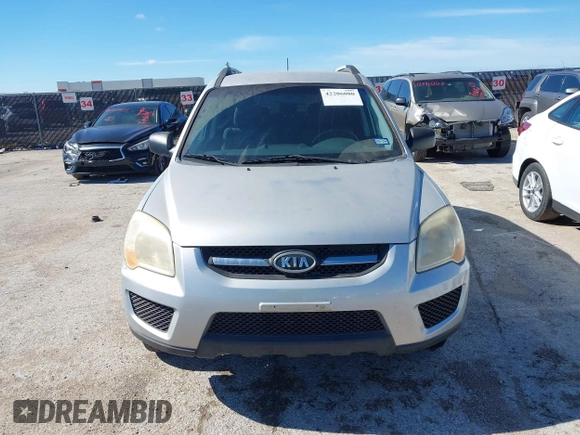 2009 Kia Sportage LX with VIN KNDJF724X97556574, listed as a IAAI auction lot 42206080 with 115,868 mi miles and . Bid and sale history available at carsss.com. Image 6.