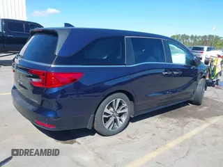 2022 Honda Odyssey Touring z VIN 5FNRL6H86NB013615, wystawiony jako IAAI lot #39139696 z przebiegiem 83 262 mil mil oraz . Historia ofert i sprzedaży dostępna na DreamBid. Obrazek 4.
