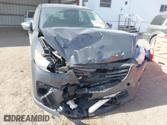2016 Mazda CX-5 Sport with VIN JM3KE4BY0G0623365, listed as a IAAI auction lot 41525002 with 127,674 mi miles and . Bid and sale history available at carsss.com. Image 6.