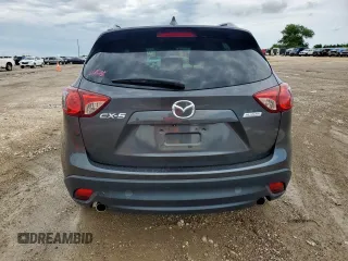 2014 Mazda CX-5 Touring z VIN JM3KE2CY7E0308580, wystawiony jako Copart lot #60565835 z przebiegiem 92 708 mil mil oraz Szkoda całkowita • Salvage title. Historia ofert i sprzedaży dostępna na DreamBid. Obrazek 6.