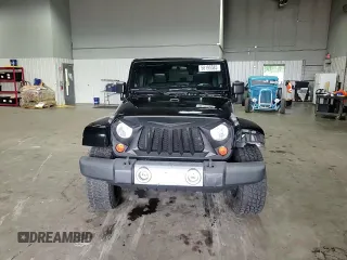 2012 Jeep Wrangler Unlimited Sahara with VIN 1C4BJWEG8CL235893, listed as a Copart auction lot 58195585 with 142,179 mi miles and Salvage title. Bid and sale history available at DreamBid. Image 14.