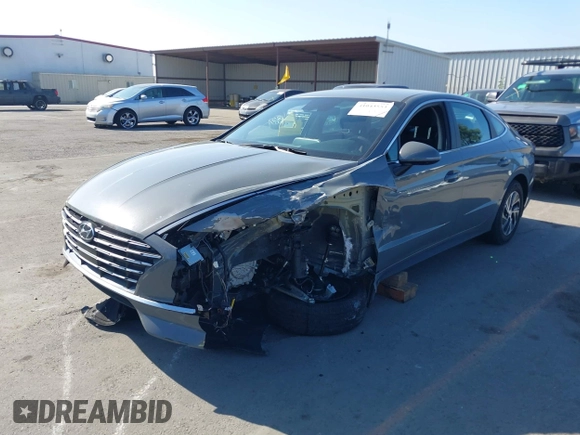 2022 Hyundai Sonata Hybrid Blue with VIN KMHL24JJ1NA041773, listed as a IAAI auction lot 41043553 with 23,696 mi miles. Bid and sale history available at carsss.com. Image 6.