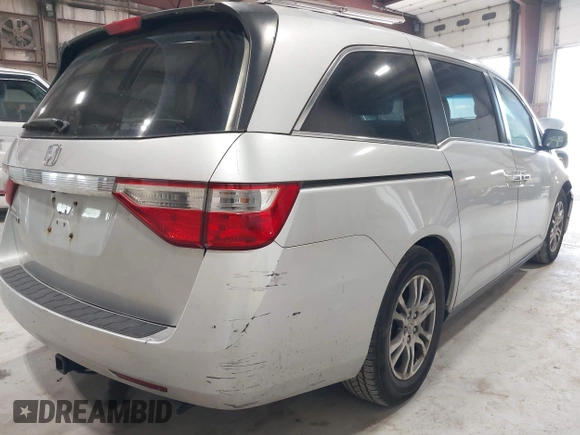 2012 Honda Odyssey EX z VIN 5FNRL5H47CB045705, wystawiony jako IAAI lot #42384430 z przebiegiem 157 598 mil mil oraz . Historia ofert i sprzedaży dostępna na DreamBid. Obrazek 20.