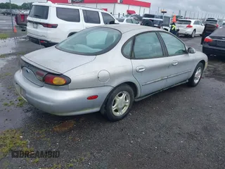 1997 Ford Taurus GL z VIN 1FALP52UXVG180596, wystawiony jako IAAI lot #42463461 z przebiegiem 190 419 mil mil oraz . Historia ofert i sprzedaży dostępna na DreamBid. Obrazek 4.
