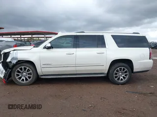 2015 GMC Yukon XL Denali with VIN 1GKS2JKJ2FR590502, listed as a IAAI auction lot 41758575 with 129,777 mi miles. Bid and sale history available at carsss.com. Image 13.