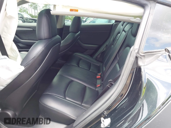 2022 Tesla Model 3 with VIN 5YJ3E1EA3NF287512, listed as a IAAI auction lot 42000557 with 77,619 mi miles. Bid and sale history available at carsss.com. Image 8.