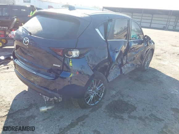 2019 Mazda CX-5 Touring with VIN JM3KFACM5K1608354, listed as a IAAI auction lot 41675828 with NaN miles. Bid and sale history available at carsss.com. Image 4.