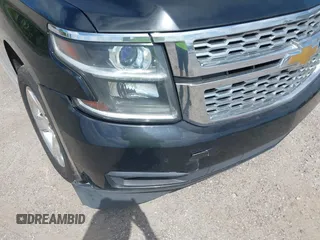 2015 Chevrolet Tahoe LT with VIN 1GNSCBKC1FR615817, listed as a IAAI auction lot 41760474 with 242,148 mi miles and . Bid and sale history available at DreamBid. Image 6.