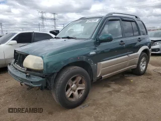 2002 Suzuki Grand Vitara z VIN JS3TE62V524154419, wystawiony jako Copart lot #52992735 z przebiegiem 123 749 mil mil oraz Szkoda całkowita • Salvage title. Historia ofert i sprzedaży dostępna na DreamBid. Obrazek 1.
