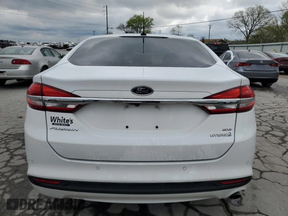 2018 Ford Fusion SE z VIN 3FA6P0LU2JR234975, wystawiony jako Copart lot #52562945 z przebiegiem 148 801 mil mil oraz Szkoda całkowita • Salvage title. Historia ofert i sprzedaży dostępna na DreamBid. Obrazek 6.