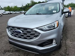 2021 Ford Edge Titanium z VIN 2FMPK3K9XMBA50703, wystawiony jako IAAI lot #42185807 z przebiegiem 100 242 mil mil oraz . Historia ofert i sprzedaży dostępna na DreamBid. Obrazek 1.