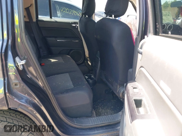 2014 Jeep Patriot Sport with VIN 1C4NJRBB8ED778620, listed as a IAAI auction lot 42021020 with 140,736 mi miles. Bid and sale history available at carsss.com. Image 8.