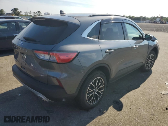 2021 Ford Escape Titanium Plug-In Hybrid z VIN 1FMCU0LZ1MUB17737, wystawiony jako Copart lot #57162592 z przebiegiem Nie podano mil oraz . Historia ofert i sprzedaży dostępna na DreamBid. Obrazek 4.