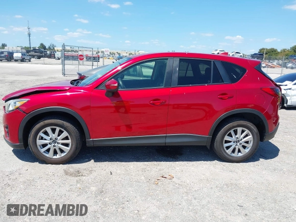 2016 Mazda CX-5 Touring with VIN JM3KE2CY6G0830409, listed as a IAAI auction lot 42049299 with 39,317 mi miles. Bid and sale history available at carsss.com. Image 14.