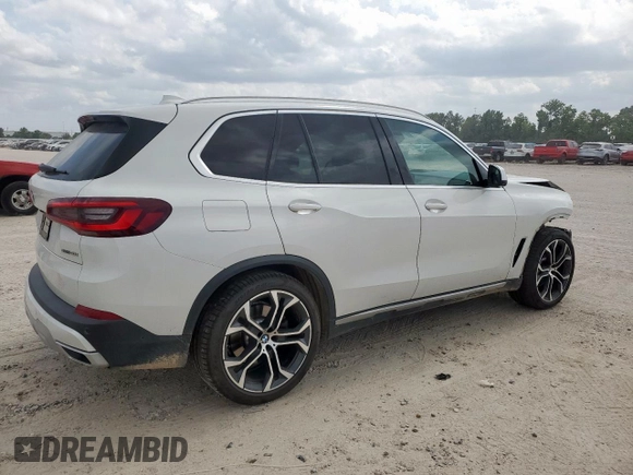 2021 BMW X5 sDrive40i with VIN 5UXCR4C06M9F56578, listed as a Copart auction lot 58218315 with 69,927 mi miles and Salvage title. Bid and sale history available at DreamBid. Image 3.
