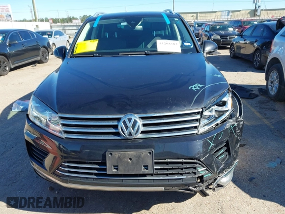2016 Volkswagen Touareg Sport with VIN WVGEF9BP4GD012265, listed as a IAAI auction lot 41208383 with 69,205 mi miles and . Bid and sale history available at DreamBid. Image 12.